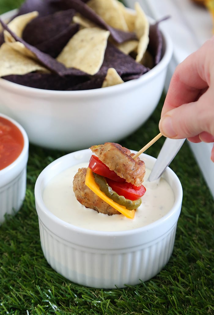 Chips and salsa with an appetizer dipped in ranch dressing
